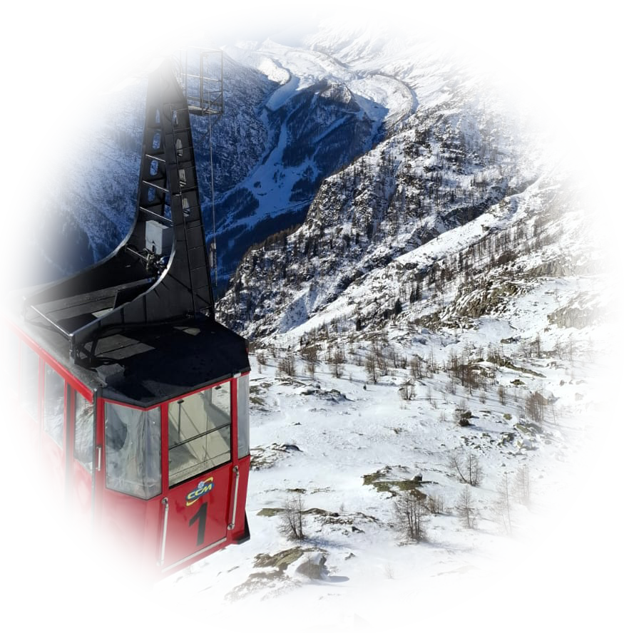 a red cable car on a snowy mountain